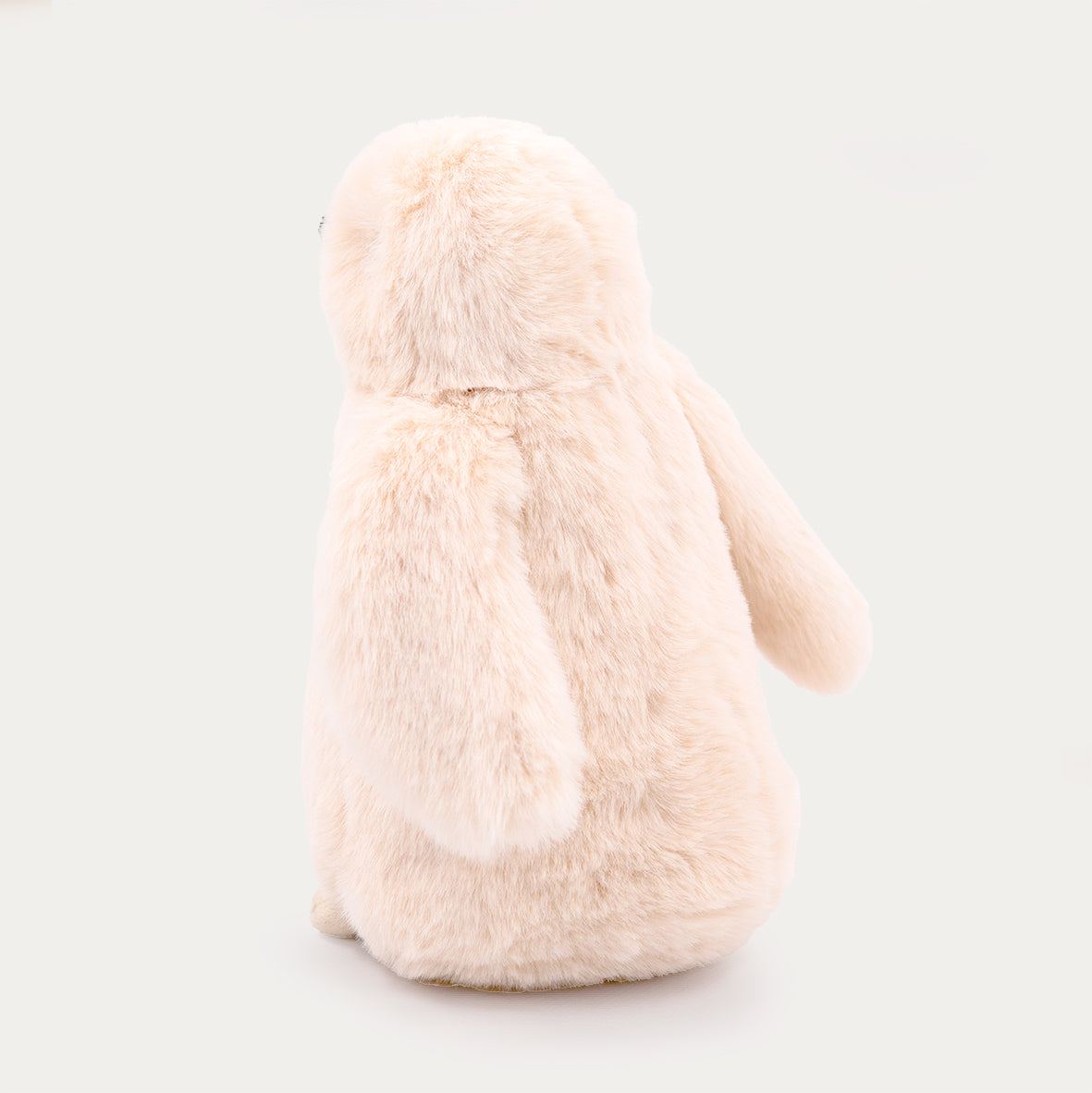 Winston the stuffed penguin plush, sitting pose