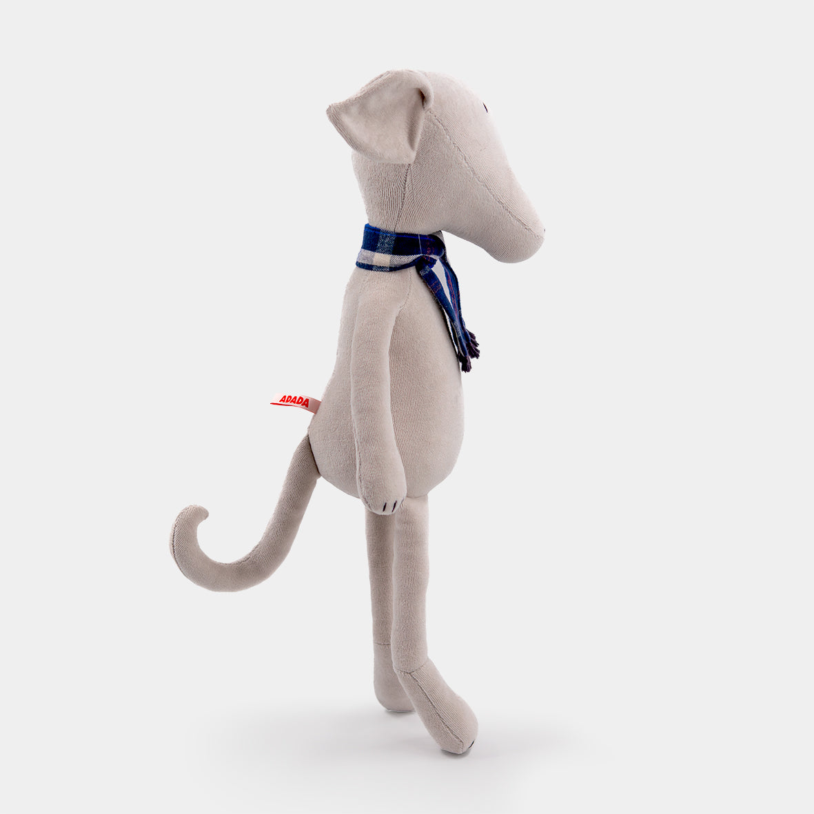 Artie the stuffed greyhound plush, standing side profile