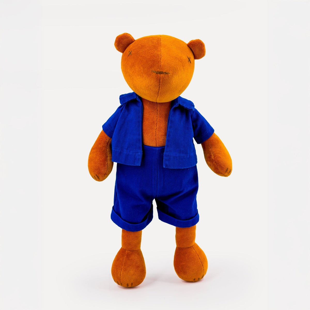 Jermaine the stuffed teddy bear plush, lifestyle photo with multiple colors
